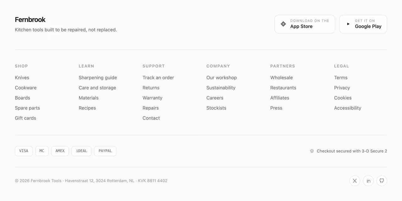 Mega footer with app badges — Tailwind CSS Footer layout preview