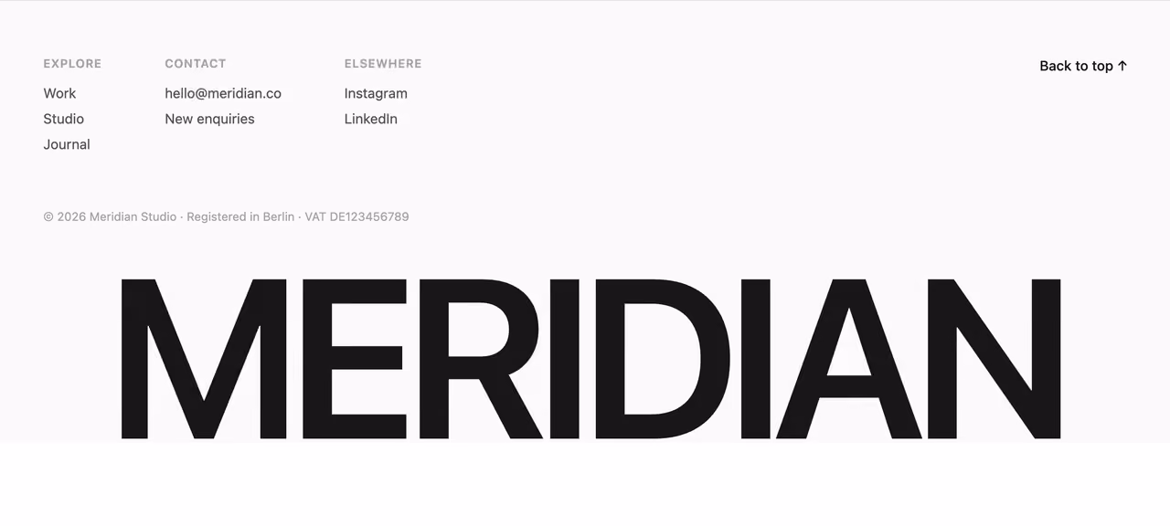 Oversized wordmark footer — Tailwind CSS Footer layout preview